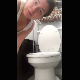 A girl stands over a toilet while spreading her ass cheeks and taking a shit. She shows us her product in the toilet bowl when finished. Vertical HD format video. Over a minute.